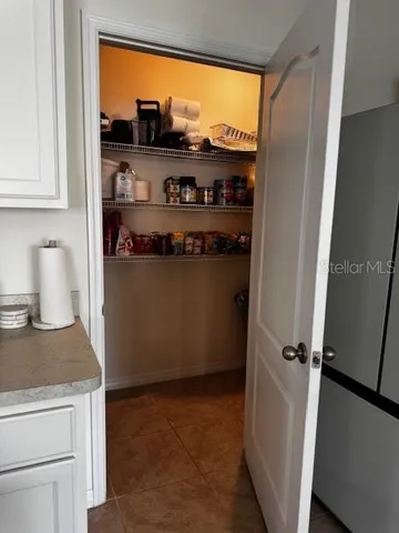 a room with an oven and wooden floor