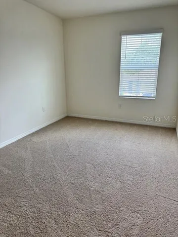 a view of an empty room and closet