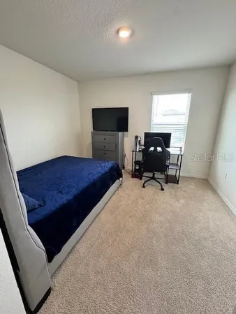 a bathroom with a double vanity sink toilet and shower