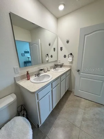 a view of garden with flowers and trees