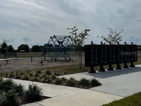 a view of a water fountain in front of a building