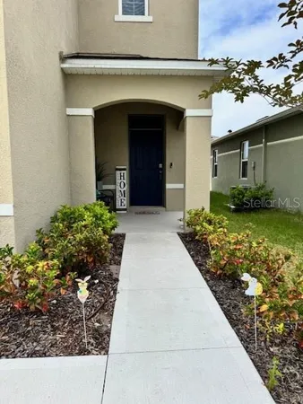 a view of a house with a garden