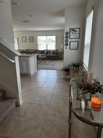 a kitchen with granite countertop a sink and a stove