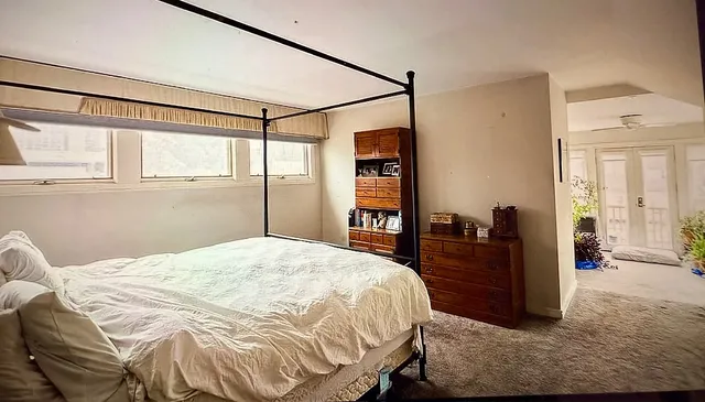 a view of an chairs and table in a room