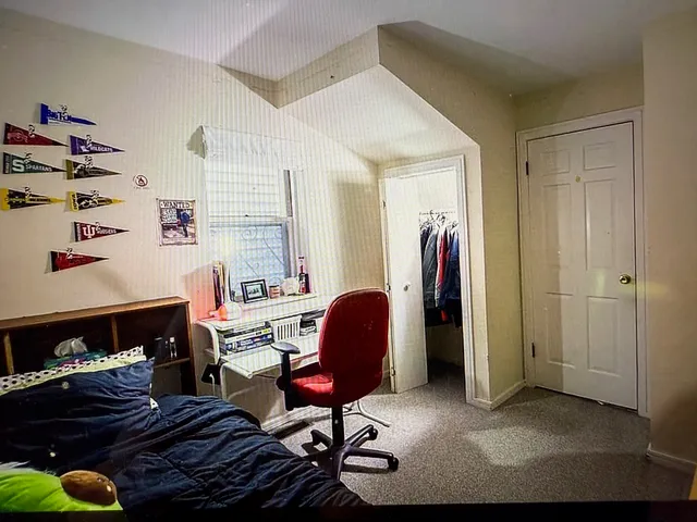 a room with a bed and a desk