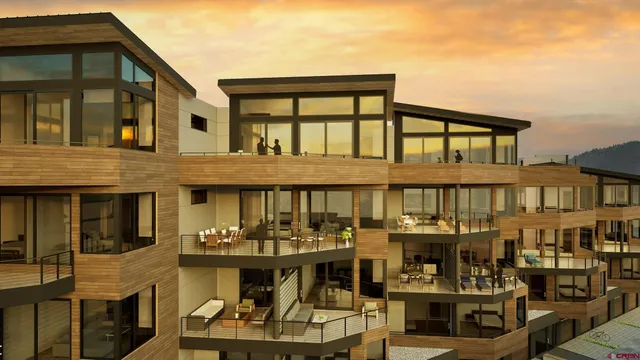 a front view of a building with outdoor seating