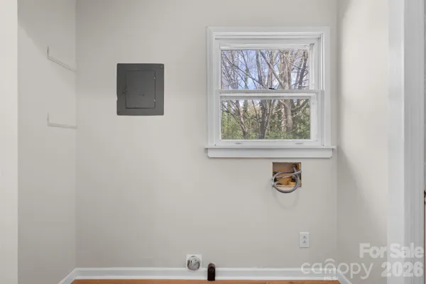 a bathroom with a window and a shower