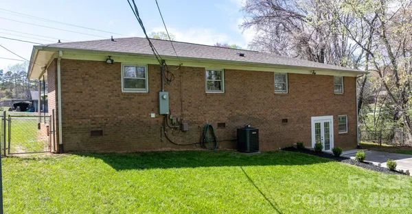 a brick house with a large garden