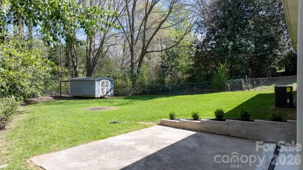 a view of a back yard with green space
