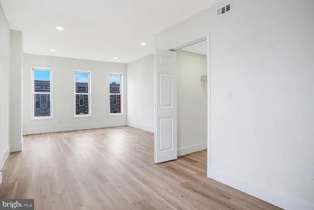a view of a livingroom with wooden floor