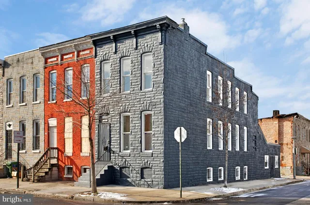 a front view of a building with a street