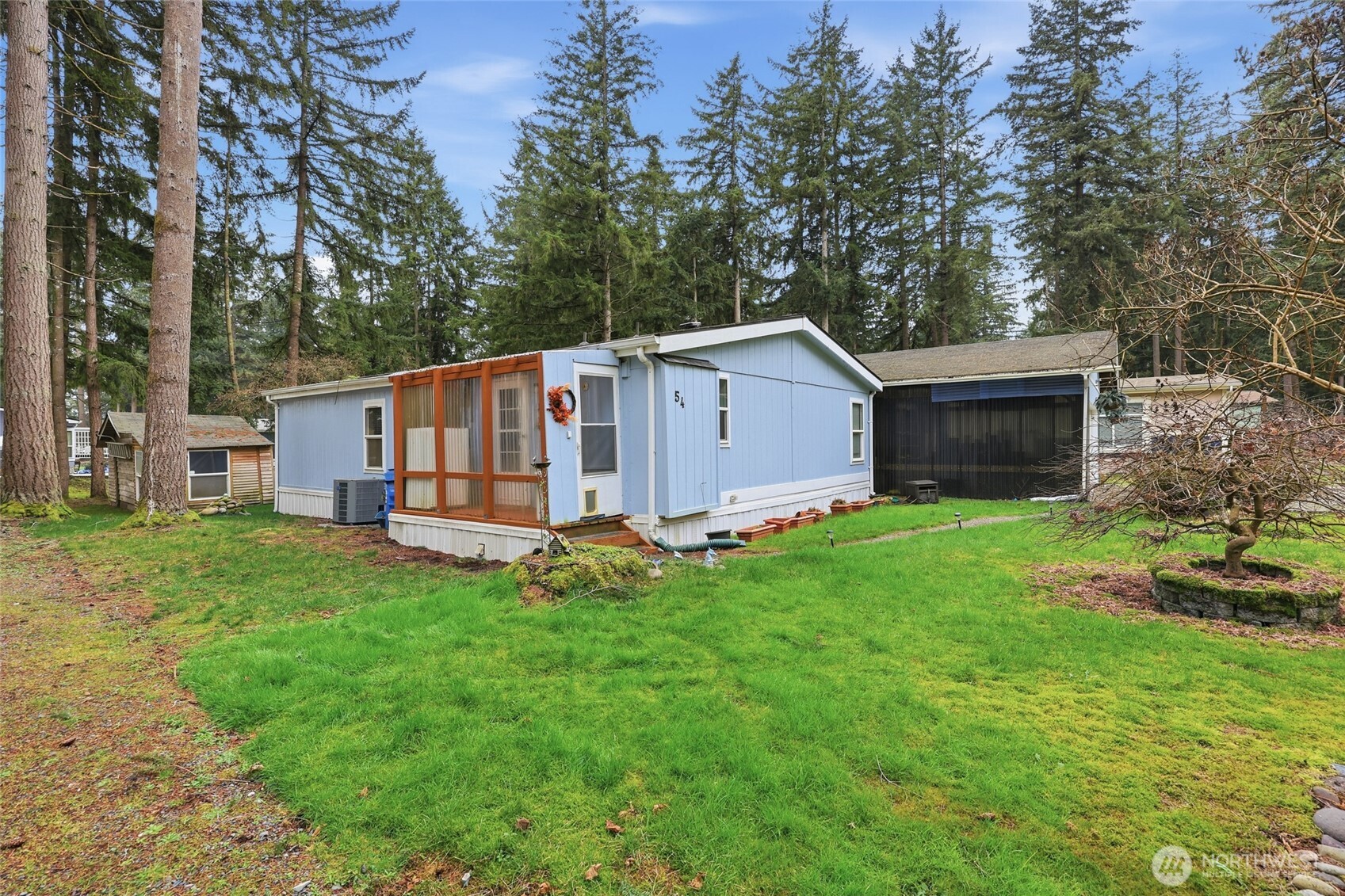 17340 Sargent Road Southwest, Unit 54 Rochester, WA 98579 - Photo 17 of 30 a view of a house with backyard and garden