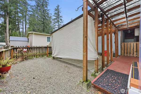 a view of a small yard next to a house