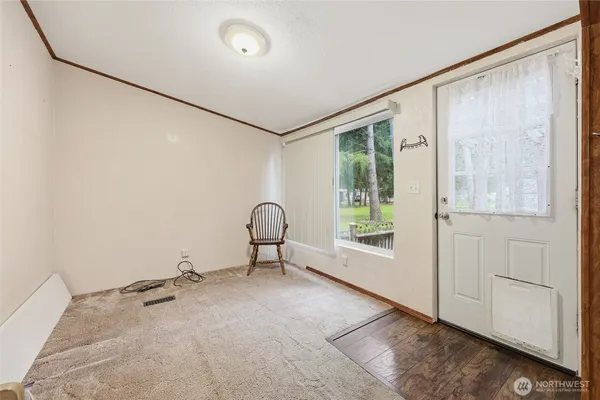 a view of an empty room with a window