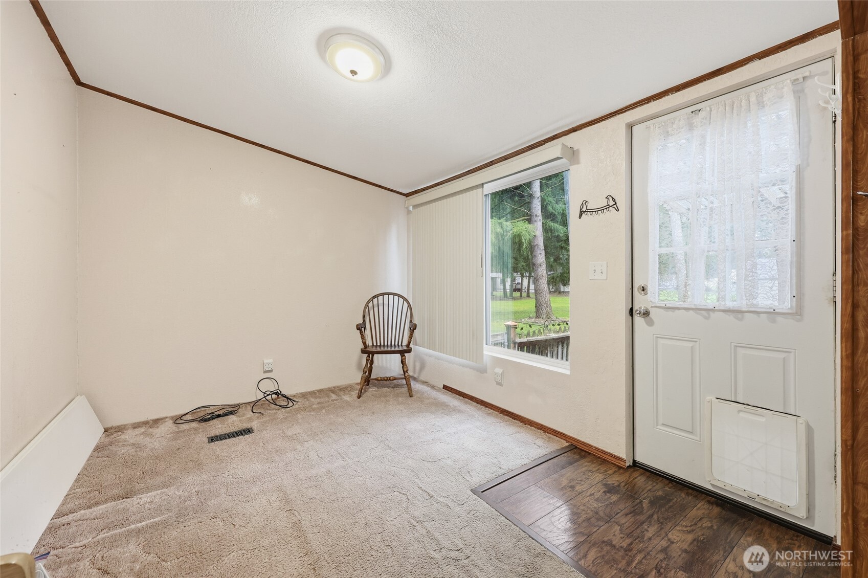 17340 Sargent Road Southwest, Unit 54 Rochester, WA 98579 - Photo 6 of 30 a view of an empty room with a window
