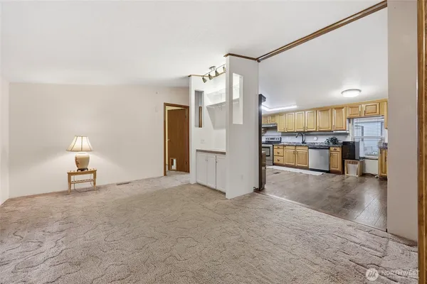 a view of a kitchen with furniture and a kitchen