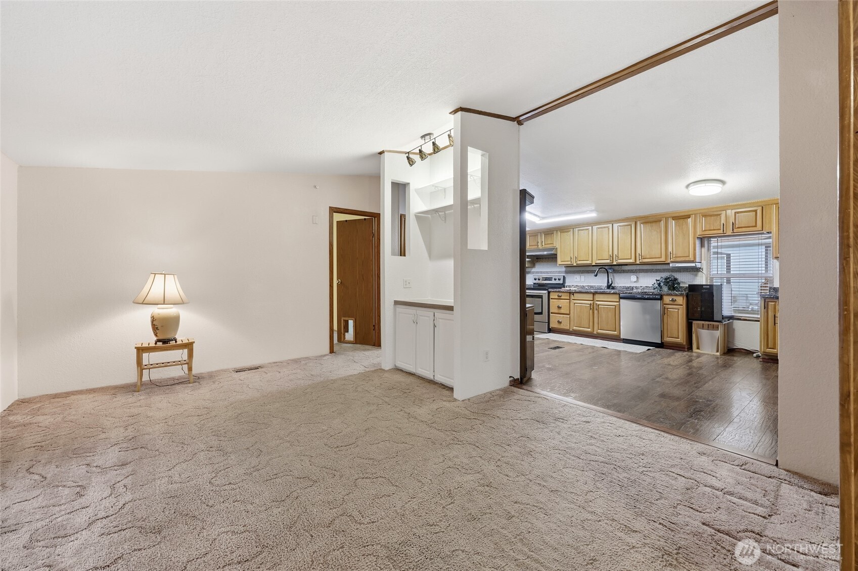 17340 Sargent Road Southwest, Unit 54 Rochester, WA 98579 - Photo 8 of 30 a view of a kitchen with furniture and a kitchen
