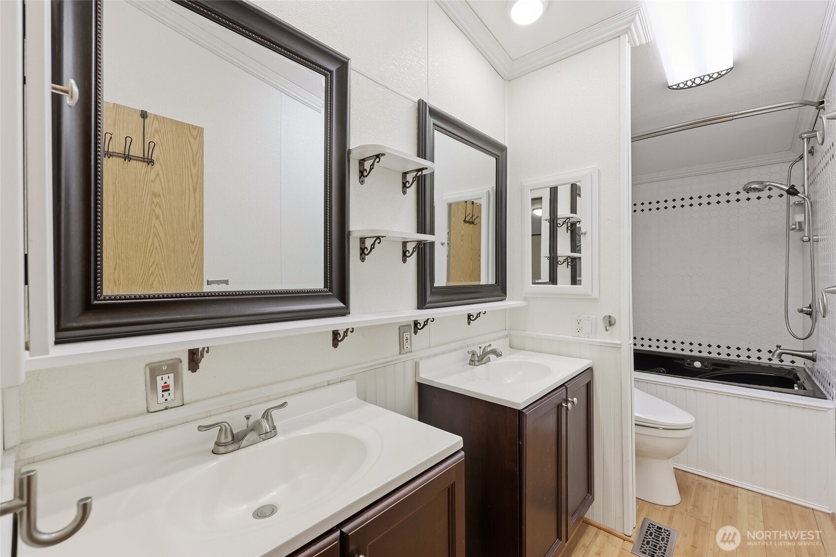 17340 Sargent Road Southwest, Unit 54 Rochester, WA 98579 - Photo 10 of 30 a bathroom with a double vanity sink mirror and toilet