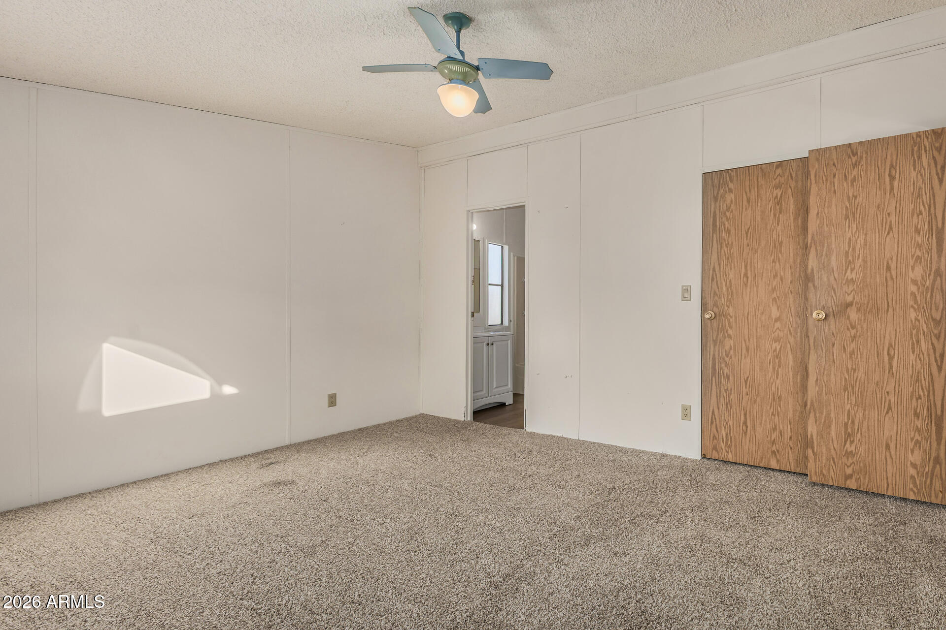 4184 Palm Lane Coolidge, AZ 85128 - Photo 15 of 47 an empty room with fan and windows