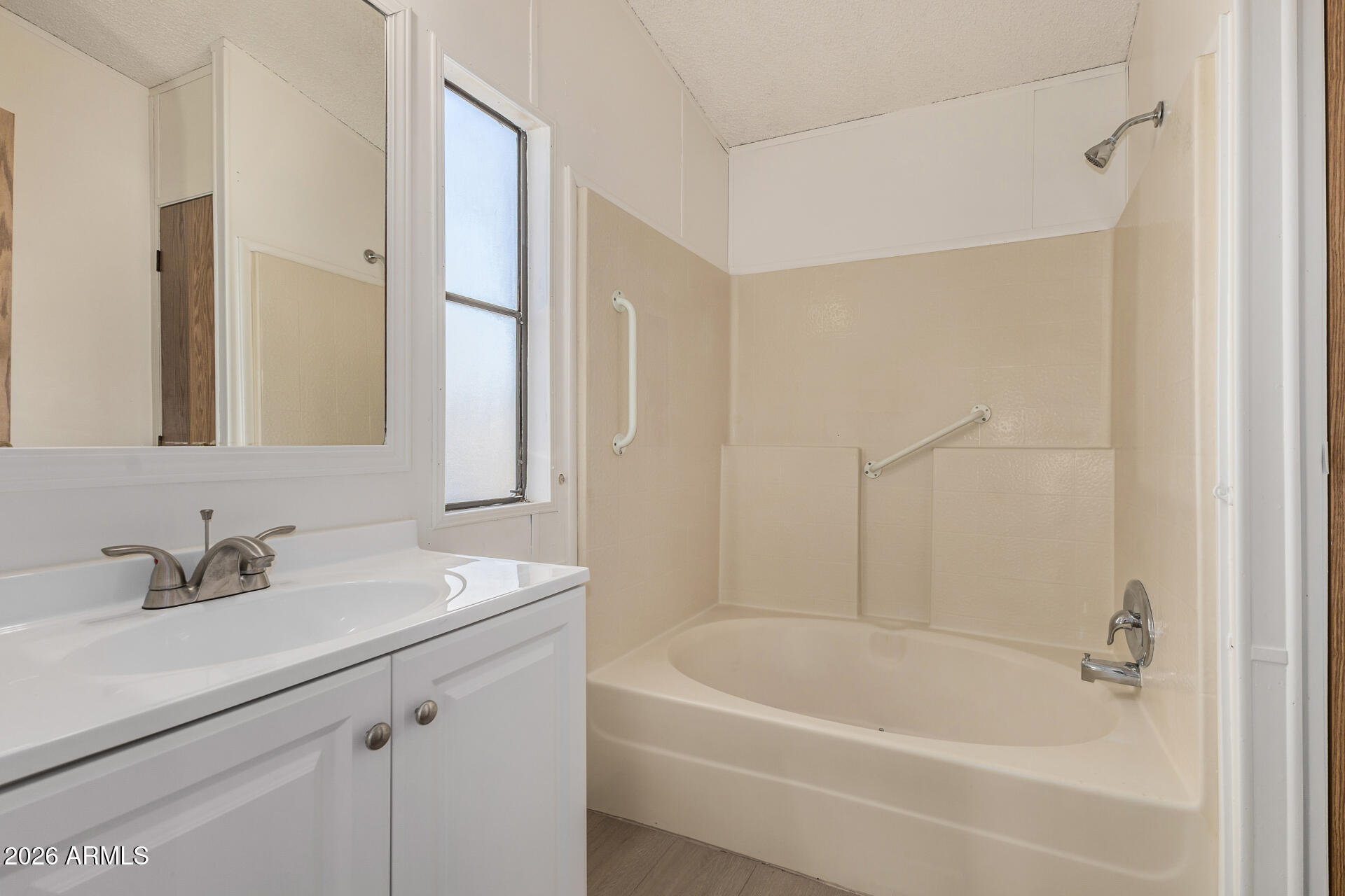 4184 Palm Lane Coolidge, AZ 85128 - Photo 16 of 47 a white bath tub sitting next to a white sink and vanity