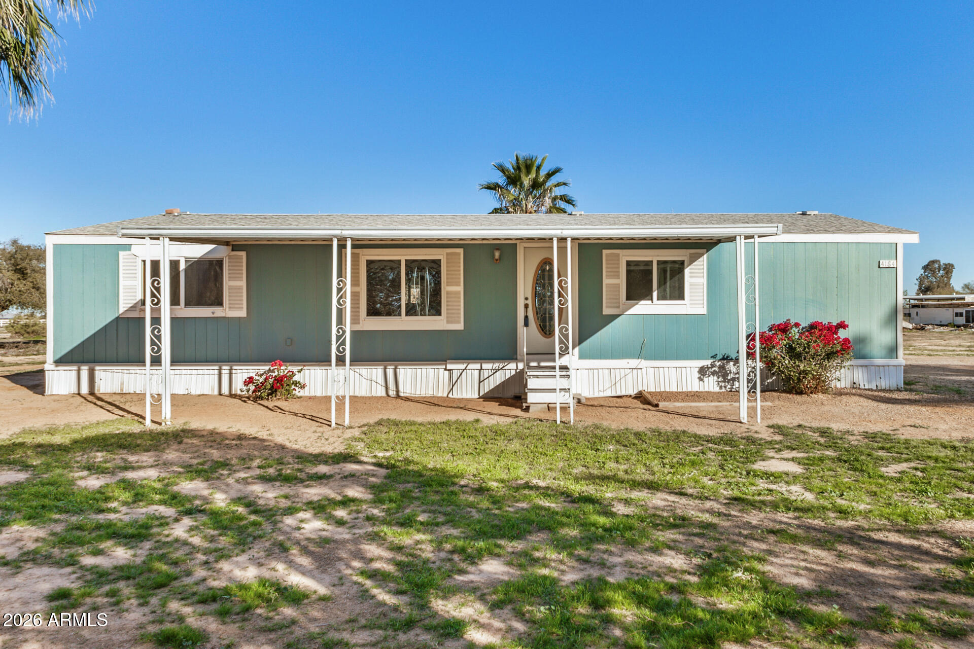 4184 Palm Lane Coolidge, AZ 85128 - Photo 2 of 47 a front view of a house with a yard