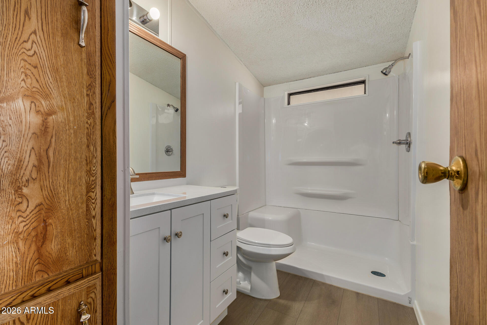 4184 Palm Lane Coolidge, AZ 85128 - Photo 22 of 47 a bathroom with a granite countertop sink a toilet and shower