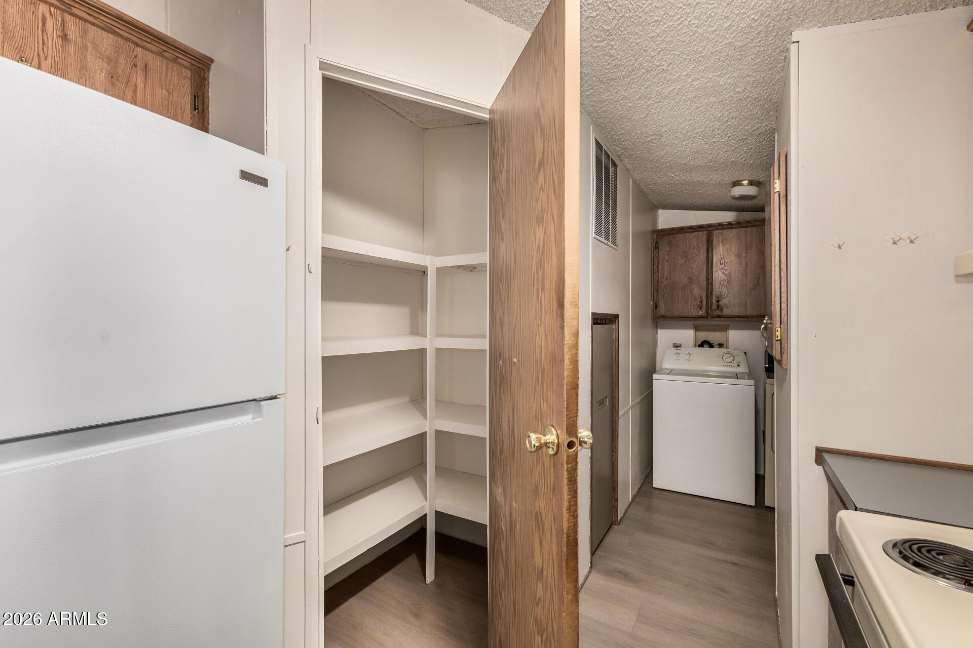 4184 Palm Lane Coolidge, AZ 85128 - Photo 24 of 47 a view of walk in closet with empty racks