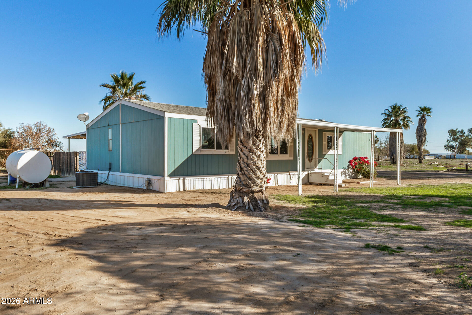 4184 Palm Lane Coolidge, AZ 85128 - Photo 6 of 47 a front view of a house with a yard
