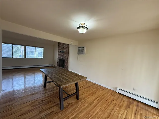 a kitchen with granite countertop a refrigerator and a sink