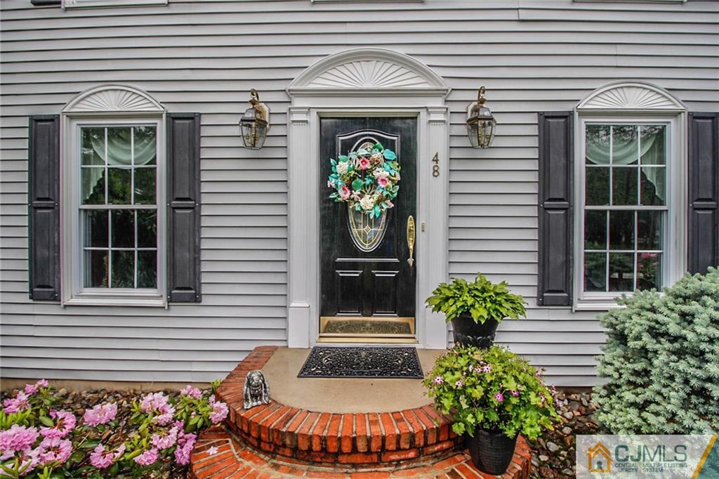 48 Harding Avenue Edison, NJ 08820 - Photo 4 of 25 a front view of a house with plants