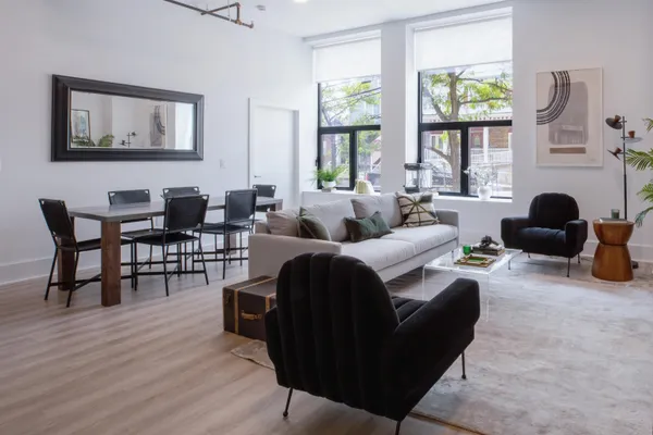 a living room with furniture and a large window
