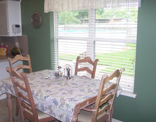 4122 Cork Drive Corpus Christi, TX 78413 - Photo 3 of 10 a view of a dining room with furniture and a window