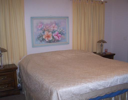 4122 Cork Drive Corpus Christi, TX 78413 - Photo 5 of 10 a large bed sitting in a bedroom next to a cabinet