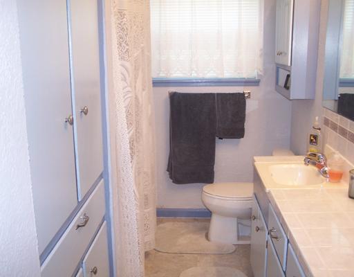 4122 Cork Drive Corpus Christi, TX 78413 - Photo 6 of 10 a bathroom with a sink toilet and window