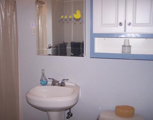 4122 Cork Drive Corpus Christi, TX 78413 - Photo 8 of 10 a bathroom with a sink and a toilet