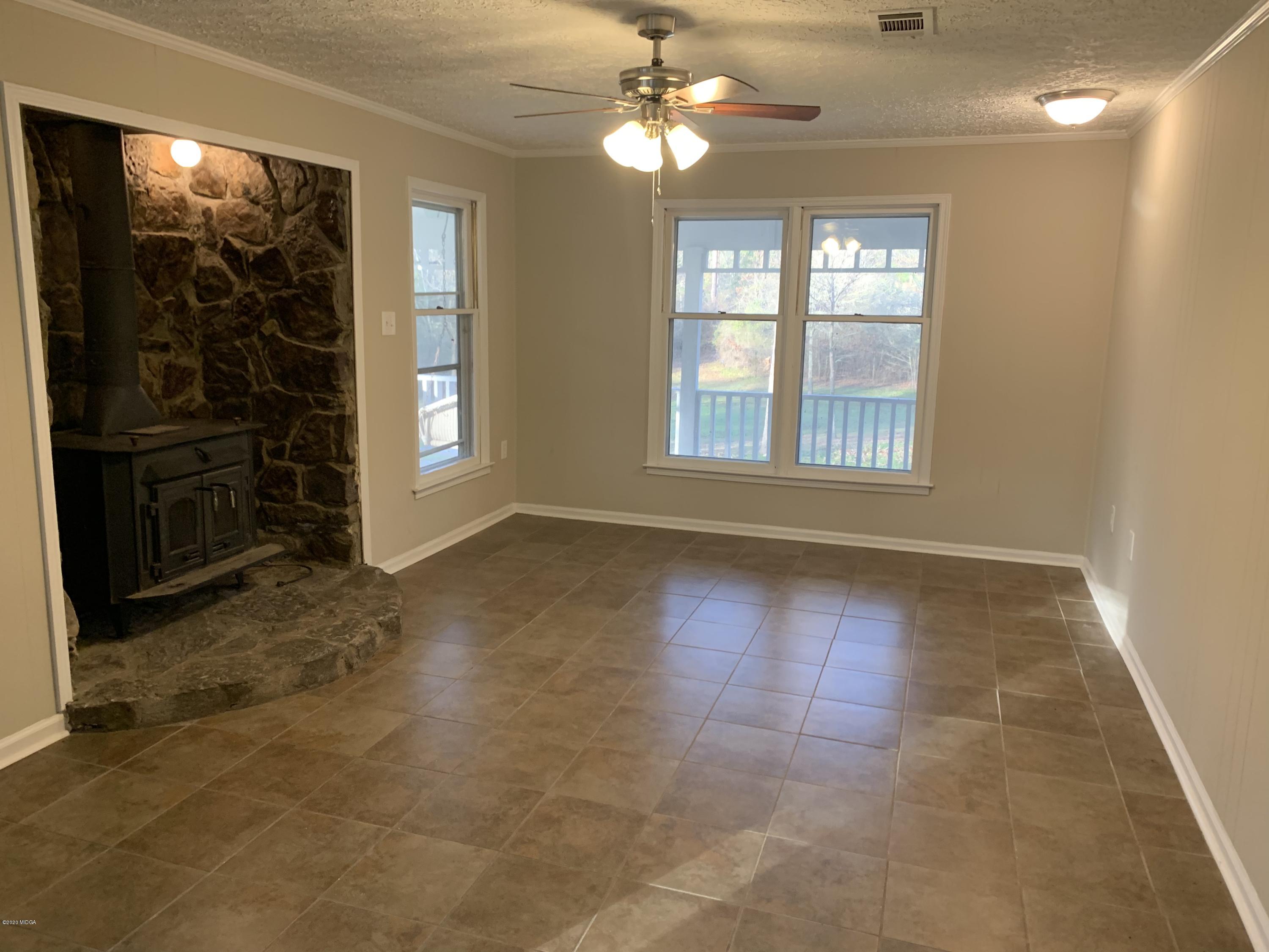 175 Red Oak Road Byron, GA 31008 - Photo 4 of 42 a view of an empty room with a window