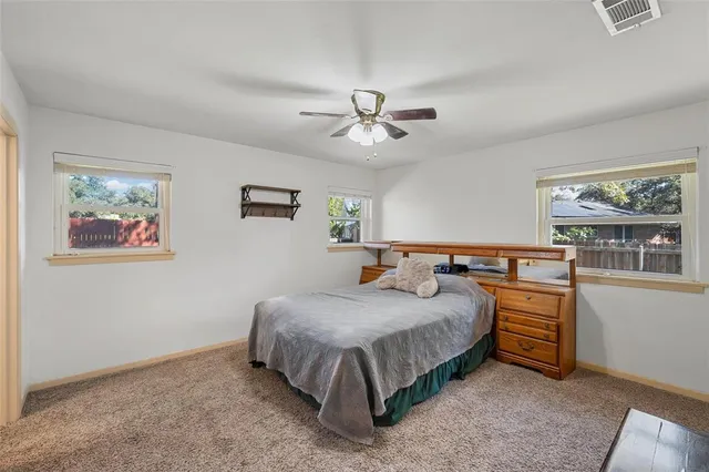 a bedroom with a bed and a cabinets
