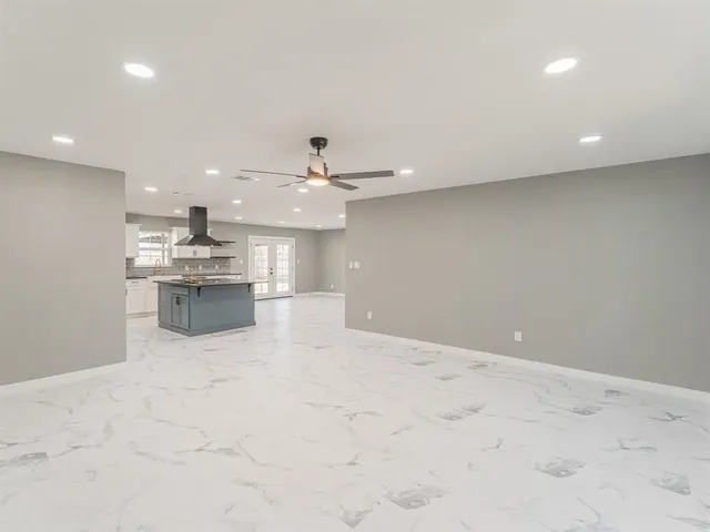 a kitchen with stainless steel appliances granite countertop a stove and a sink