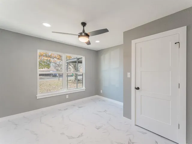 a front view of a house with a big yard