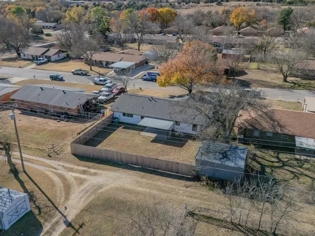 an aerial view of a house with outdoor space