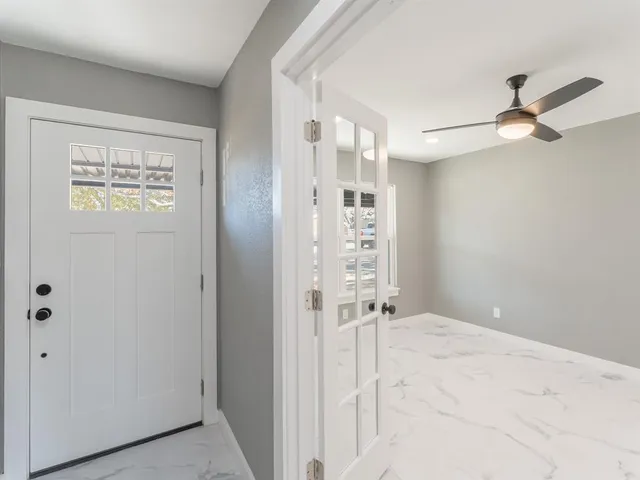 a view of an empty room with a window