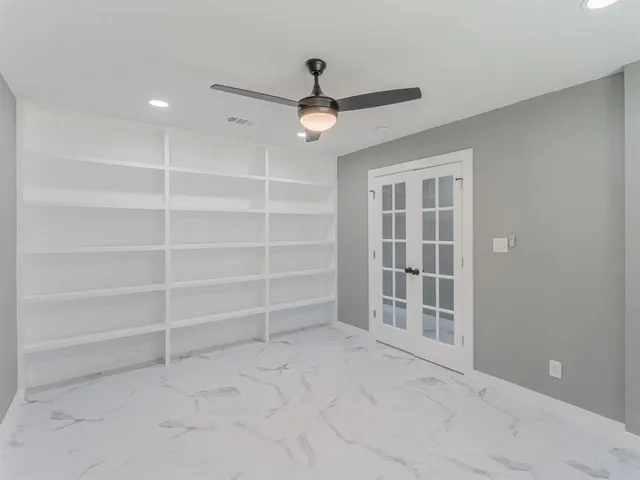 a large kitchen with stainless steel appliances granite countertop a stove a sink and a refrigerator