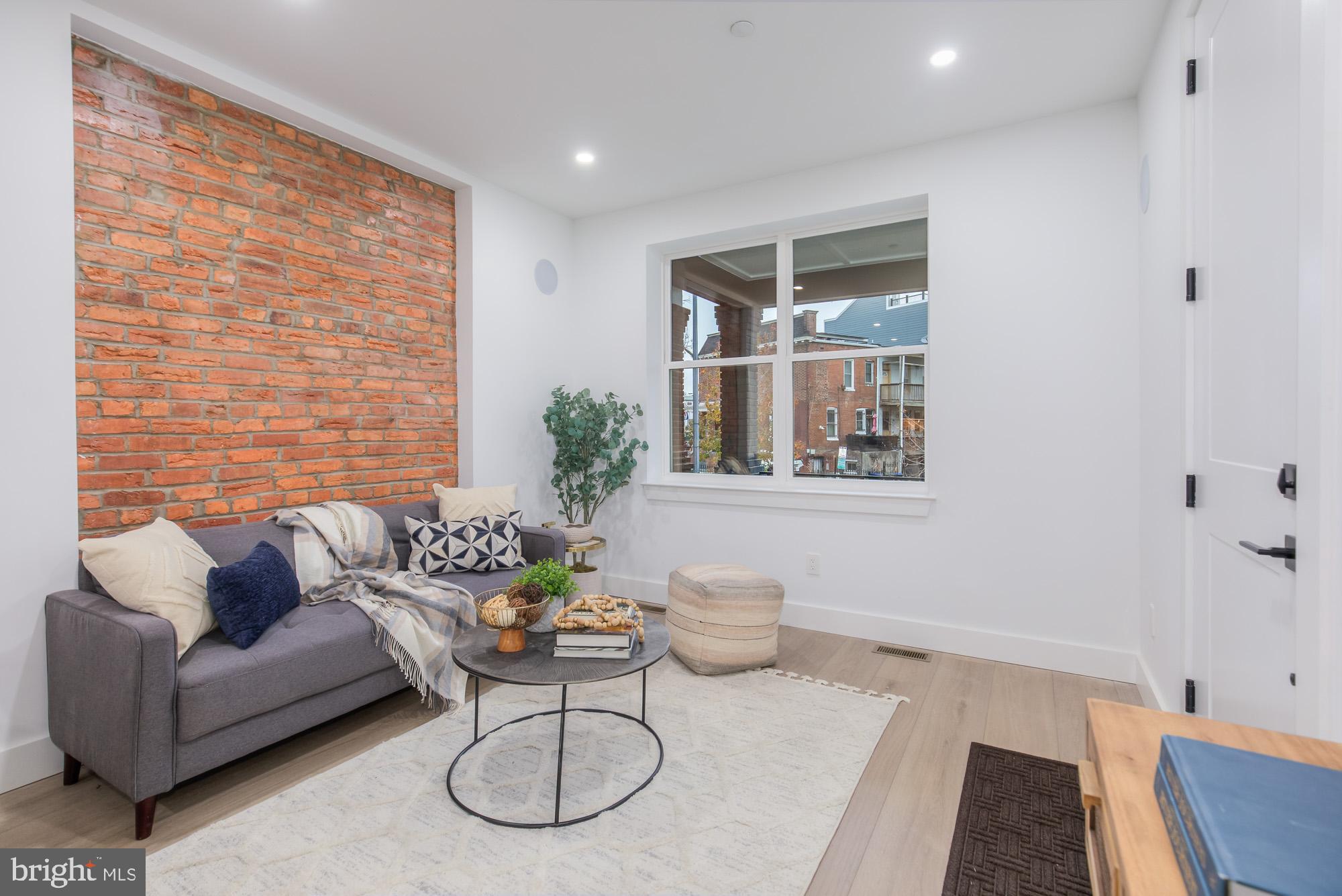 1218 5th Street Northeast, Unit A Washington, DC 20002 - Photo 5 of 25 Exposed brick in living area