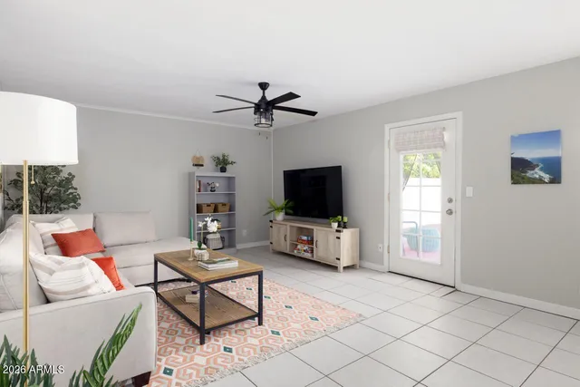 a living room with furniture and a flat screen tv