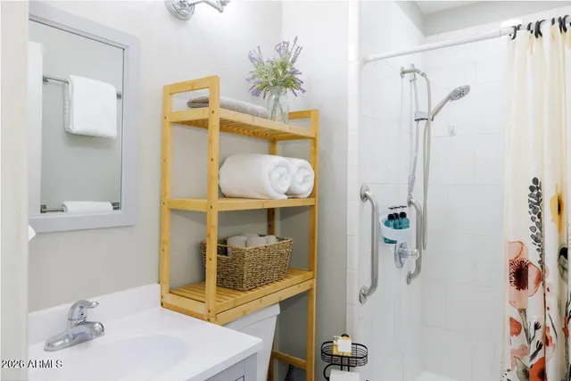 a bathroom with a sink and mirror