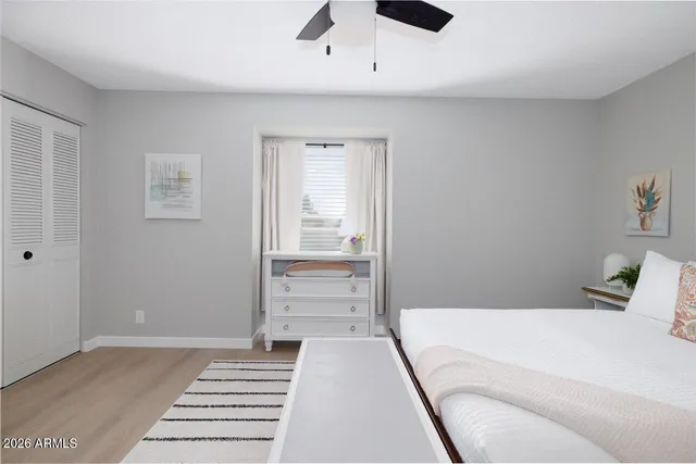 a bedroom with a bed and a walk in closet