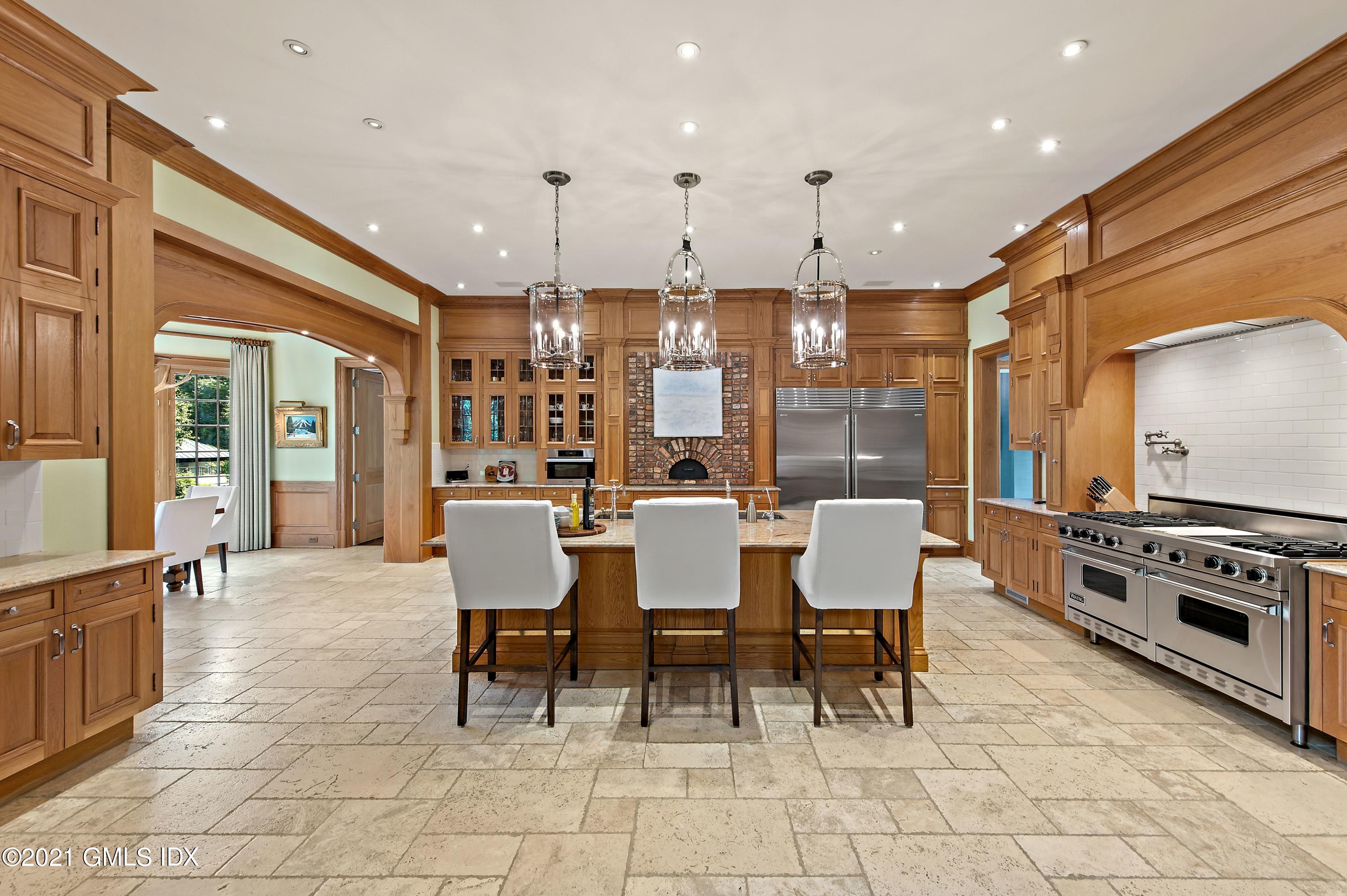 435 Round Hill Road Greenwich, CT 06831 - Photo 13 of 44 a view of a dining room with furniture
