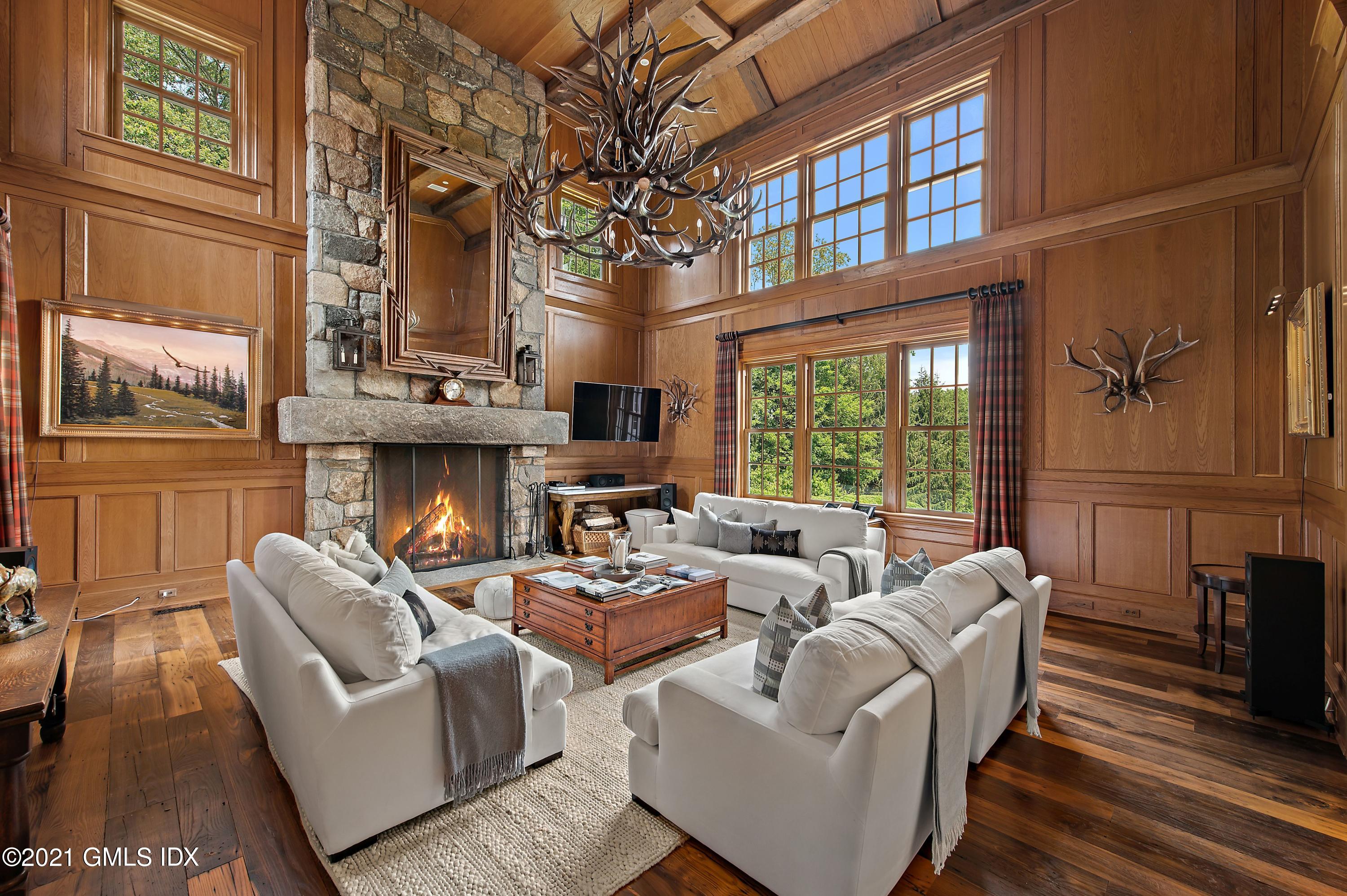 435 Round Hill Road Greenwich, CT 06831 - Photo 15 of 44 a living room with fireplace furniture and a large window