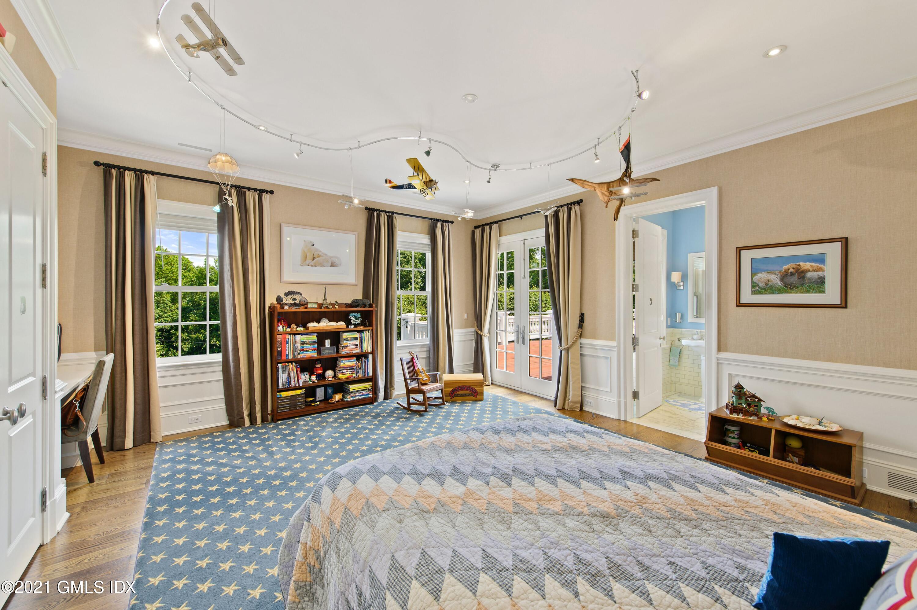 435 Round Hill Road Greenwich, CT 06831 - Photo 22 of 44 a bedroom with furniture and a window