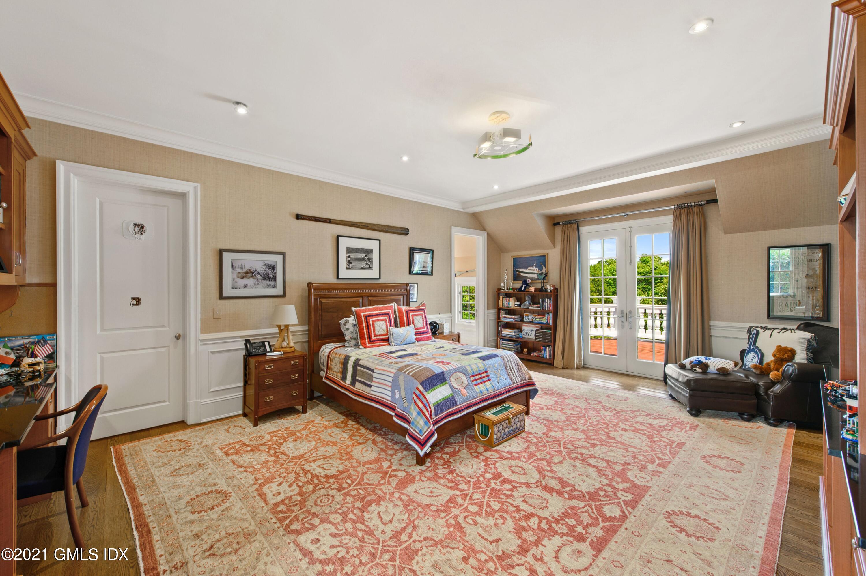 435 Round Hill Road Greenwich, CT 06831 - Photo 23 of 44 a living room with furniture and a large window
